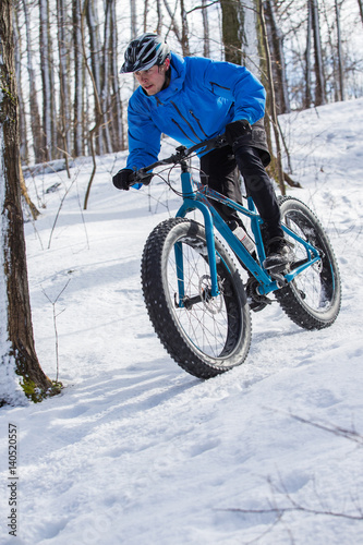 Fat biker riding in the snow