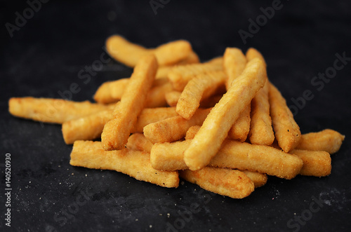 French fries on blackboard background.