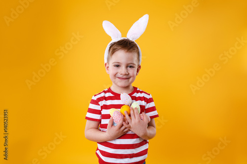 Portrait of a smiling adorable little boy wearing bunny ears