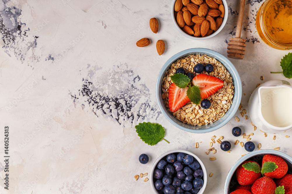 Healthy breakfast - a bowl of oatmeal, berries and fruit, top view. Healthy breakfast - a bowl of oatmeal, berries and fruit, top view.