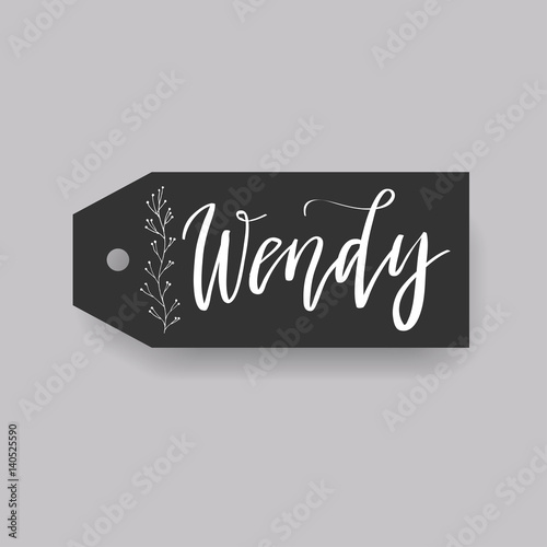 Common female first name Wendy on a tag. Hand drawn calligraphy