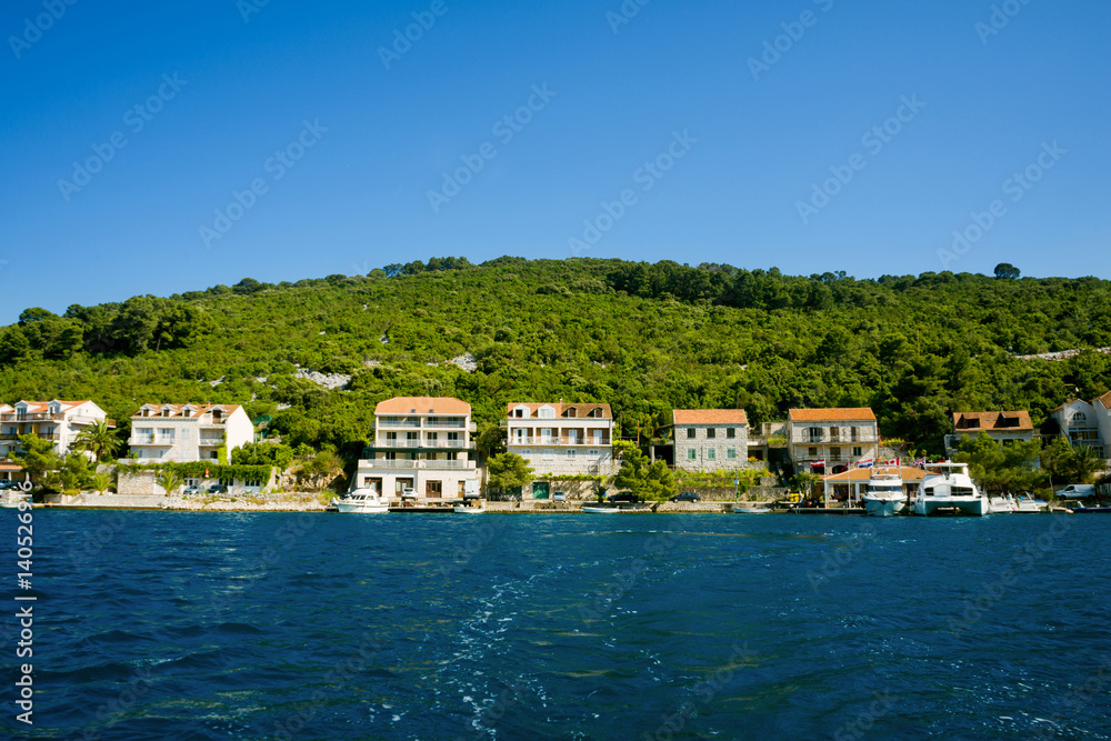 Beautiful view of the seashore from yacht. Traveling, yachting, vacation concept.