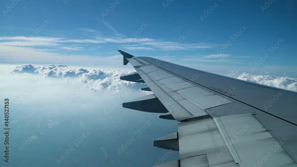Wing of airplane flying in the sky. Airplane comes into the clouds. Full HD slow motion stock footage.
Wing of airplane flying in the sky. Airplane comes into the clouds. Full HD slow motion stock footage.