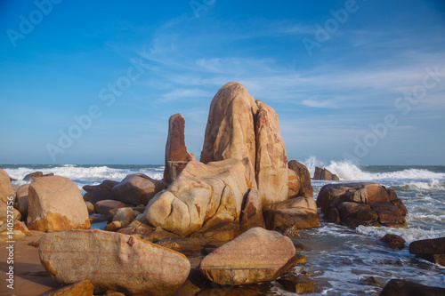 Beautiful landscape with view of ocean, perfect beach, big stones, trees, azure water. Background image. Concept travel