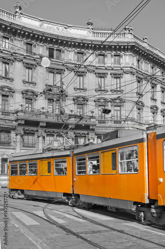 milano e tram arancione in piazza cordusio lombardia italia europa photo