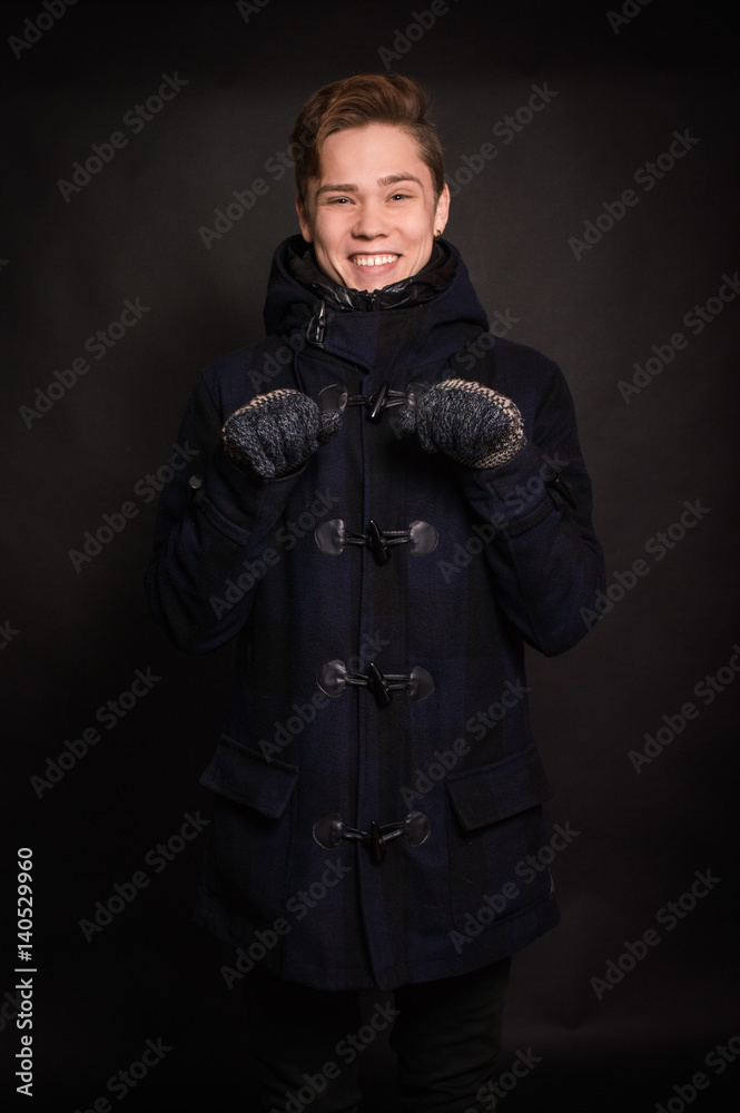 The man in the jacket on a dark background The man in the jacket on a dark background