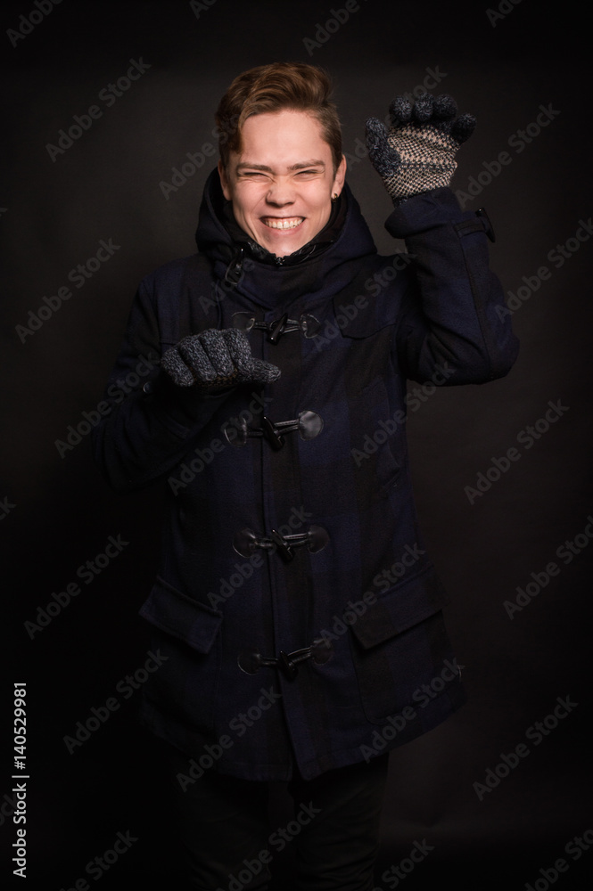 The man in the jacket on a dark background The man in the jacket on a dark background