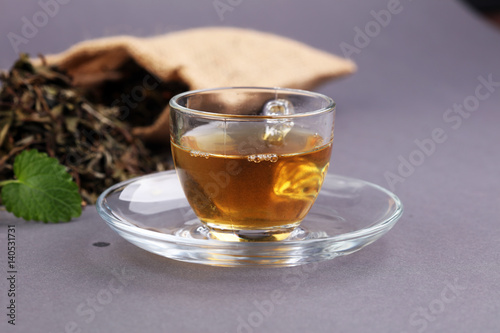 Herbal dry sri lanka tea. Mint leaf. Tea in a glass cup, mint leaves, dried tea, in a restaurant or teahouse