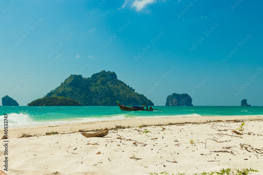 Naklejka premium Poda island (Koh Poda) beach with traditional thai longtail boat and islands in Andaman sea, Krabi province, Thailand
