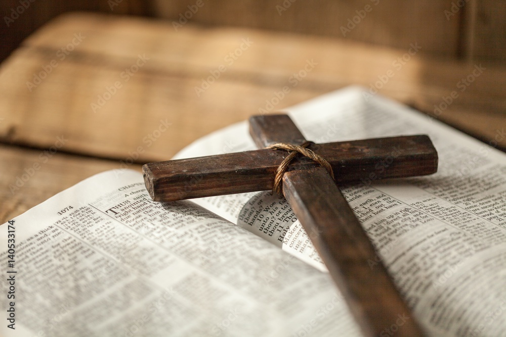 Fototapeta premium Cross on bible.
