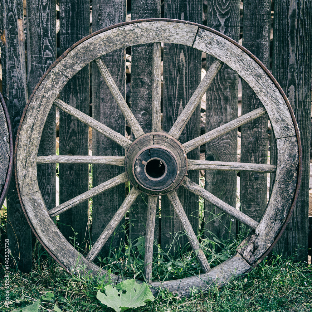 Old Wooden Cart Wheel in the village