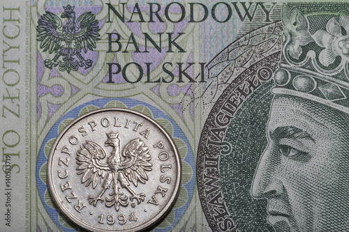 Polish one hundred zloty bill and coin macro