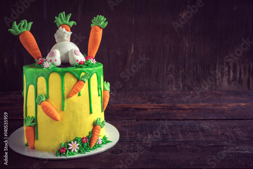 Easter cake served on the wooden background photo