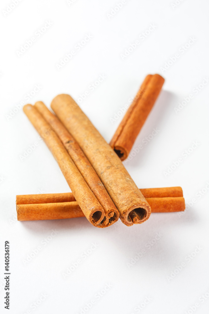 cinnamon sticks isolated on white background, close up cinnamon sticks isolated on white background, close up