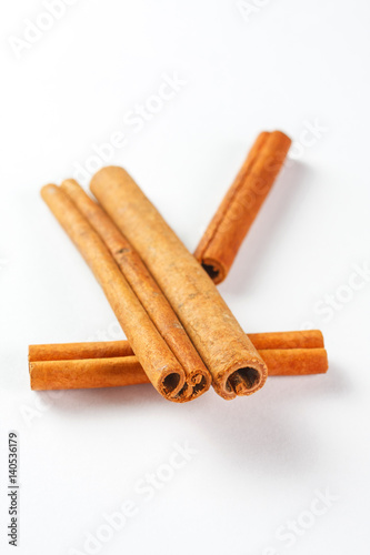 cinnamon sticks isolated on white background, close up