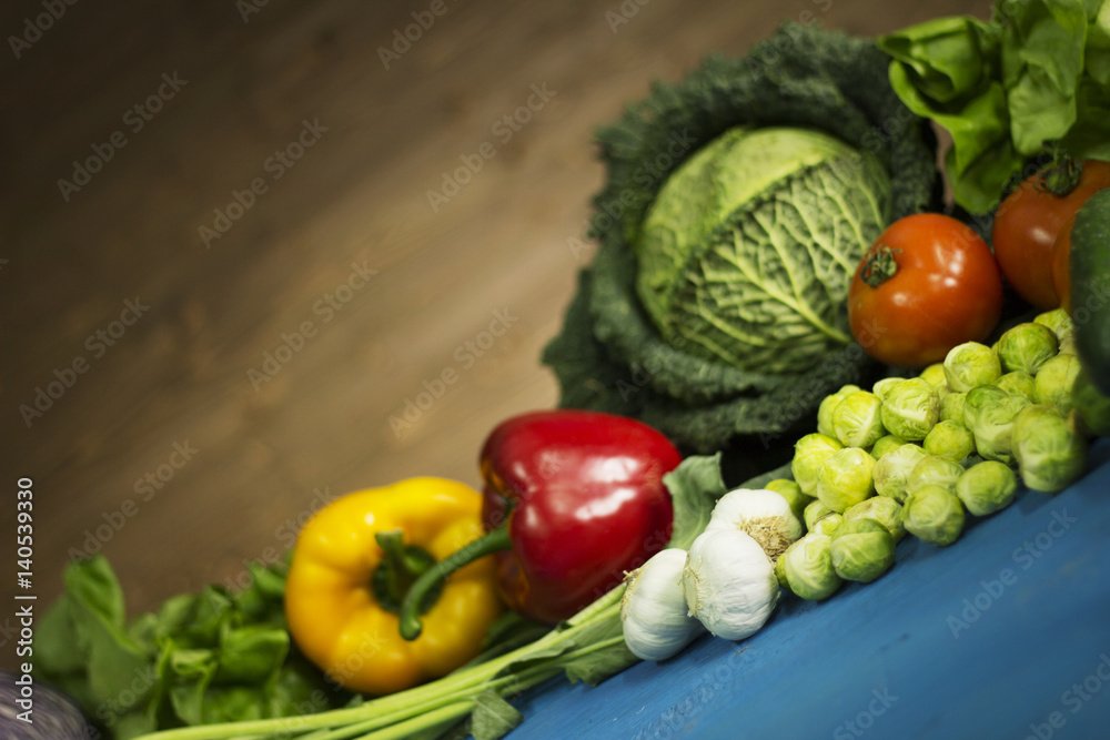 Young spring vegetables on wood. Background layout with free text space. Young spring vegetables on wood. Background layout with free text space.