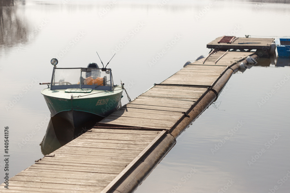 Lifeboat moored on a river pantone berth