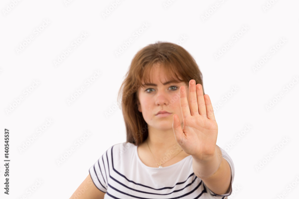 Young woman showing her denial with NO on her hand Young woman showing her denial with NO on her hand