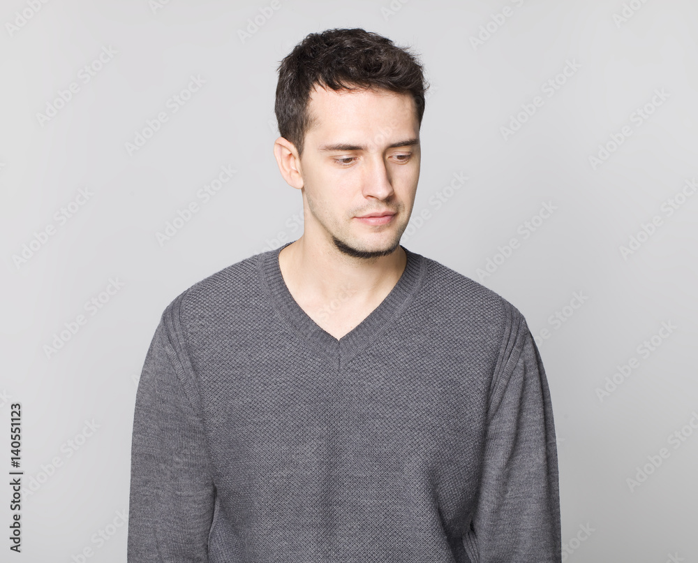 Handsome man in grey sweater portrait Handsome man in grey sweater portrait