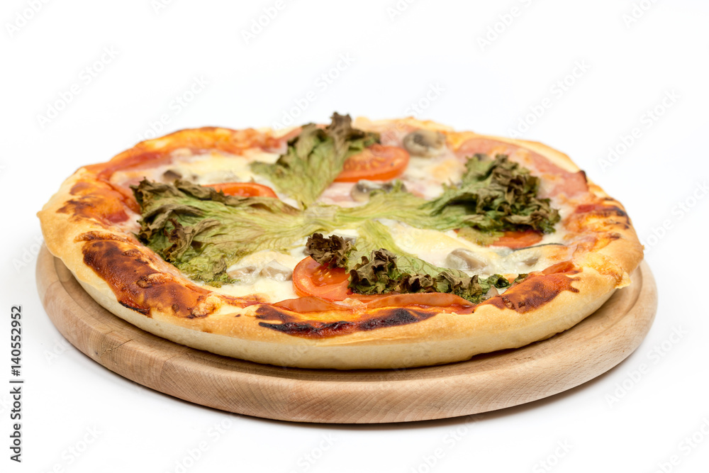 Baked round pizza with fresh lettuce and tomato with copy space Baked round pizza with fresh lettuce and tomato with copy space