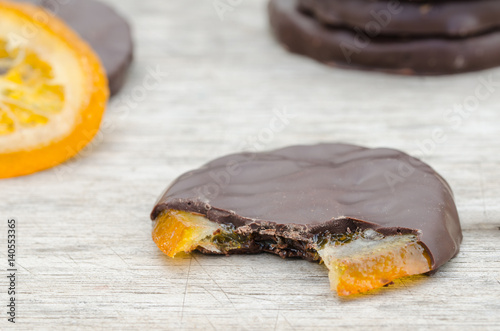 Candied orange slices covered with chocolate photo