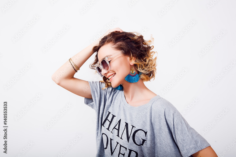 Indoor isolated fashion portrait of sexy woman in stylish glamour outfit,gray crop top, turquoise skirt and trendy sunglasses.surprised woman's face. Emotional portrait of hipster on white background Indoor isolated fashion portrait of sexy woman in stylish glamour outfit,gray crop top, turquoise skirt and trendy sunglasses.surprised woman's face. Emotional portrait of hipster on white background