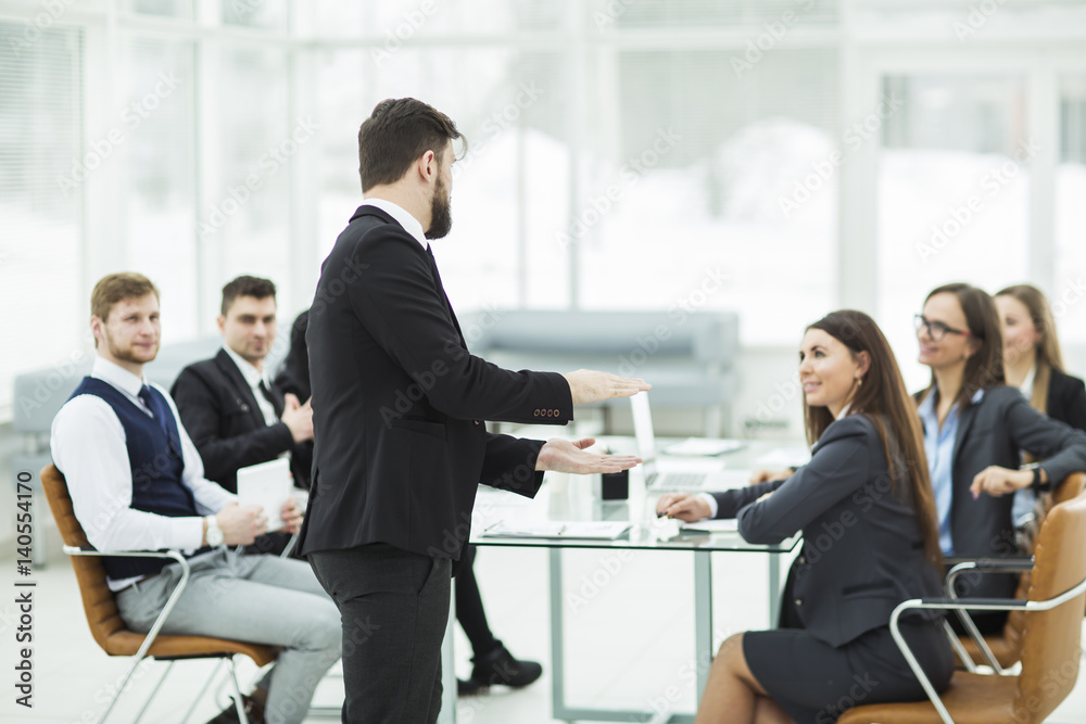 senior Manager of the company holds a working meeting with business team in modern office senior Manager of the company holds a working meeting with business team in modern office