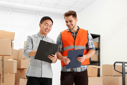 Managers checking orders at...