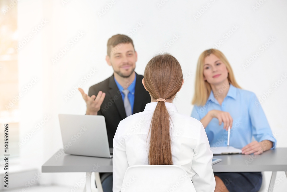 Job interview concept. Human resources commission interviewing woman