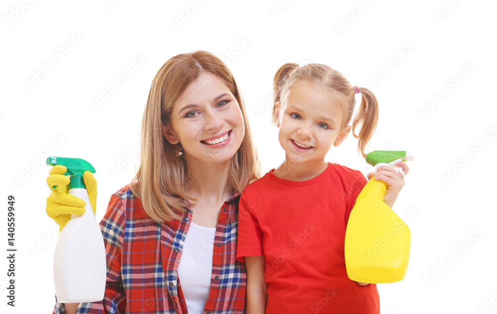 Little girl and her mother with detergents on white background Little girl and her mother with detergents on white background