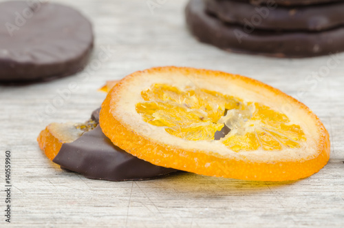 Candied orange slices covered with chocolate photo