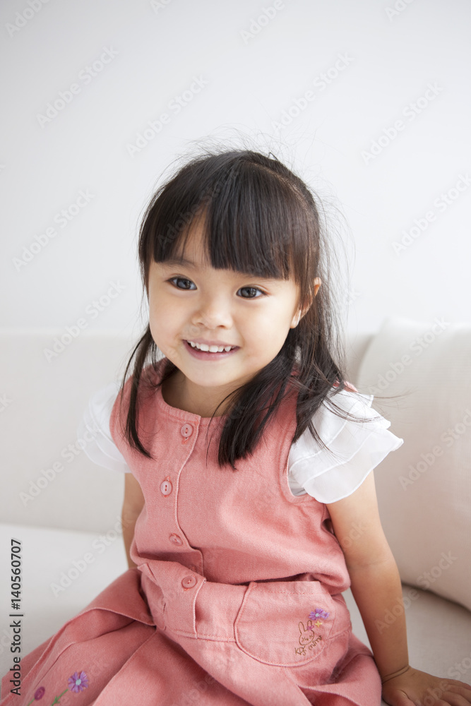 Girl sitting on sofa Girl sitting on sofa