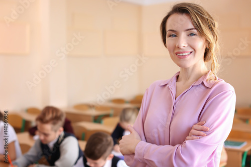 Portrait of happy teacher i...