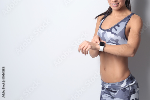 Sporty young woman with fit...