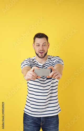 Handsome young man taking s...