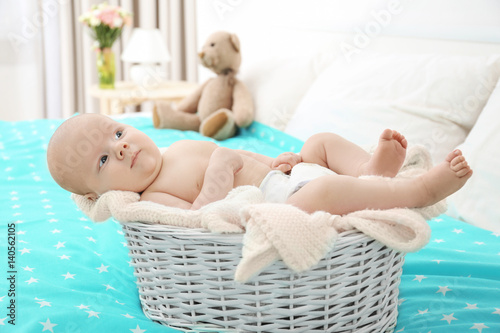 Cute little baby lying in w...
