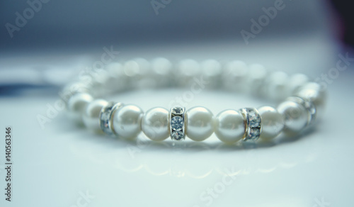 Pearl bracelet on white background. Freezer bags pearl necklace.