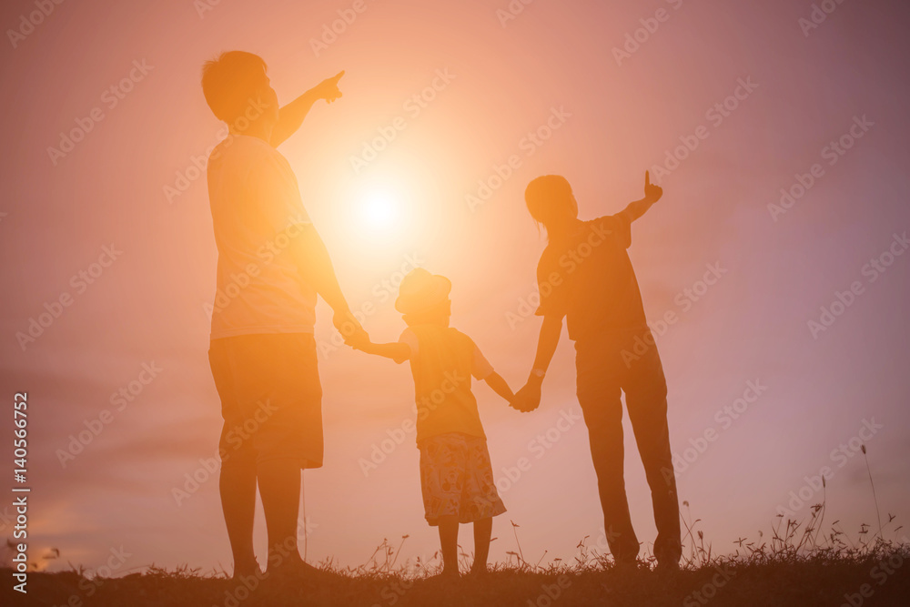 Fototapeta premium silhouette of a happy children and happy time sunset 