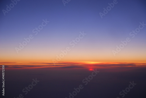 sunrise from horizon seen from air plane in the sky