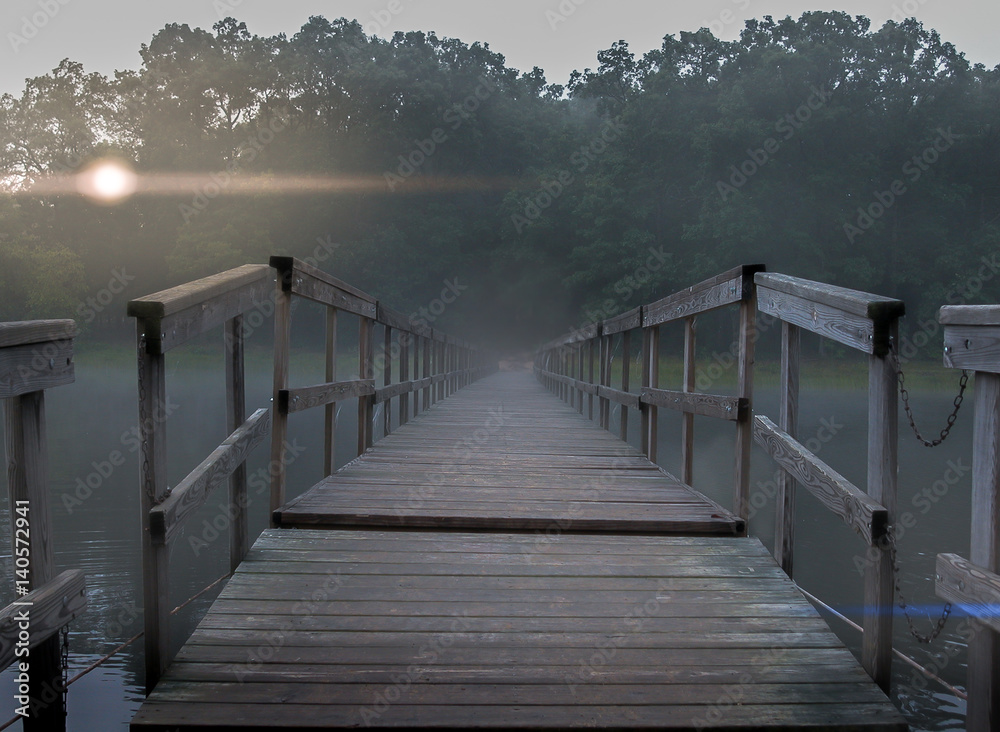 Fototapeta premium foggy footbridge sunset
