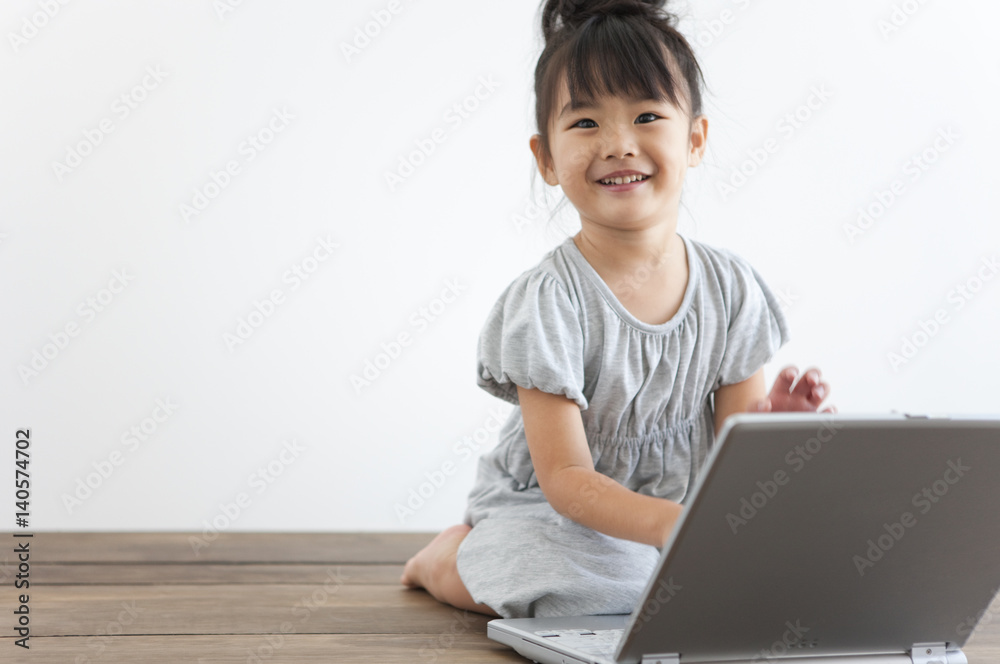 Portrait of girl using laptop, white background, copy space Portrait of girl using laptop, white background, copy space