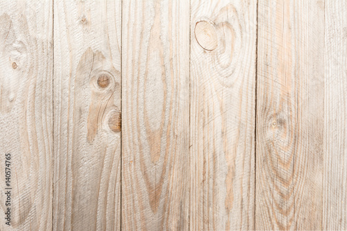 Wood texture, natural boards without additional processing, are located vertically, the wood is damaged in the form of small cracks, exfoliation, abstract background
