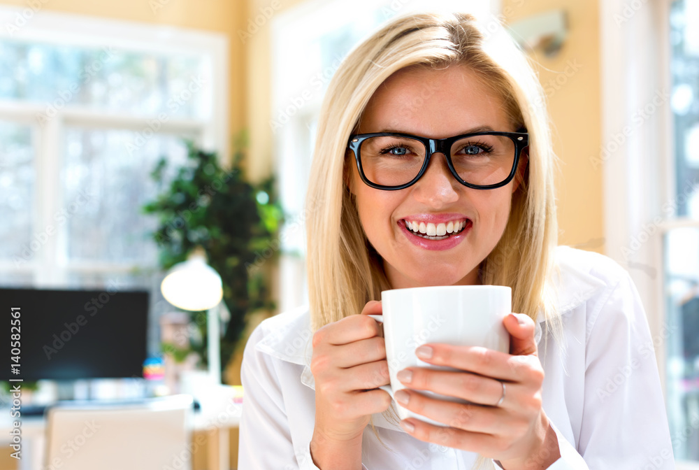Happy young woman drinking coffee Happy young woman drinking coffee