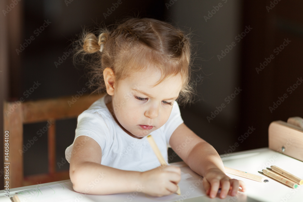 pretty little girl draws with pencils, indoor pretty little girl draws with pencils, indoor