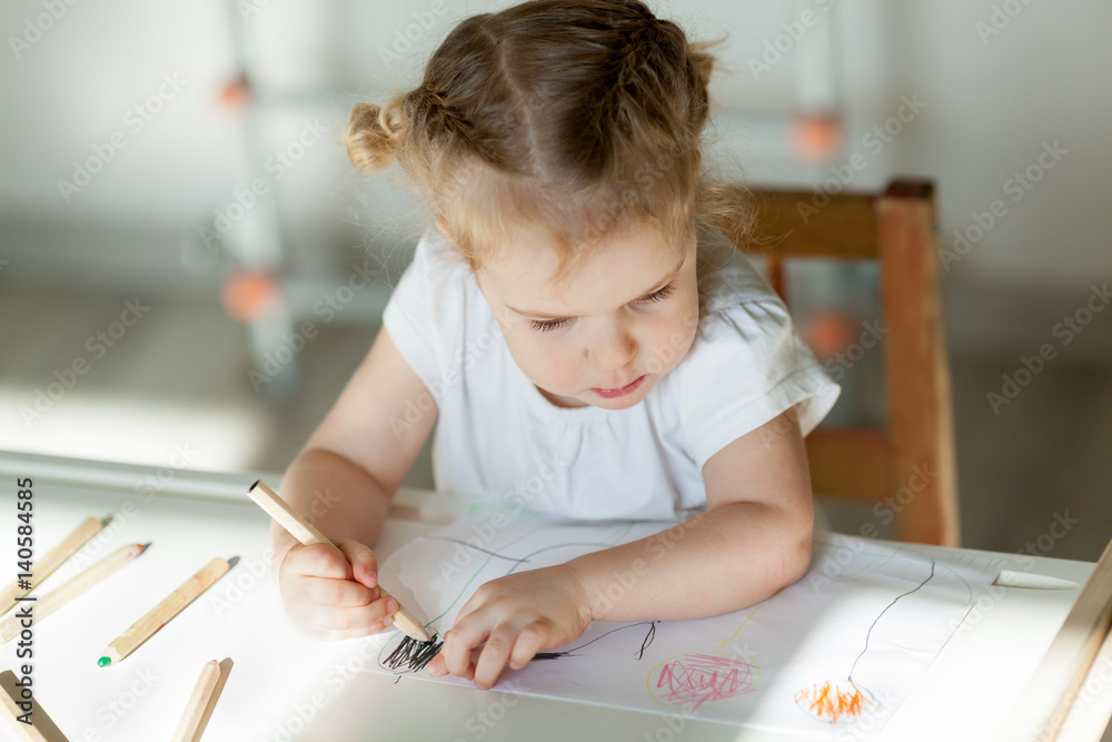 pretty little girl draws with pencils, indoor pretty little girl draws with pencils, indoor