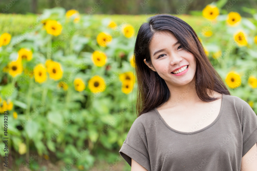 cute portrait asian Thai teen smile with sunflower with copy space. cute portrait asian Thai teen smile with sunflower with copy space.