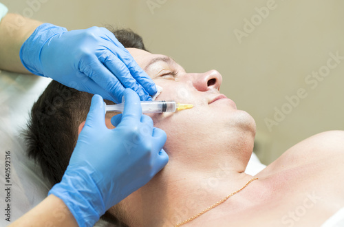 Man passes a course of mesotherapy clinic 