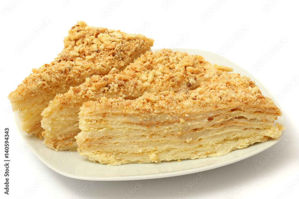 cake napoleon on plate isolated on white background
