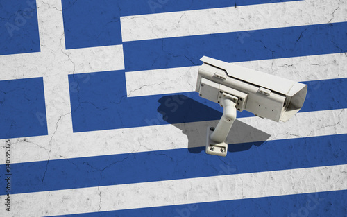 CCTV security camera on wall with flag of Greece photo