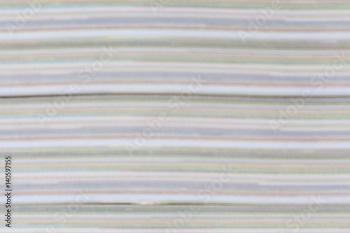 Abstract blur photo of detail color and layer book paper pages thick.